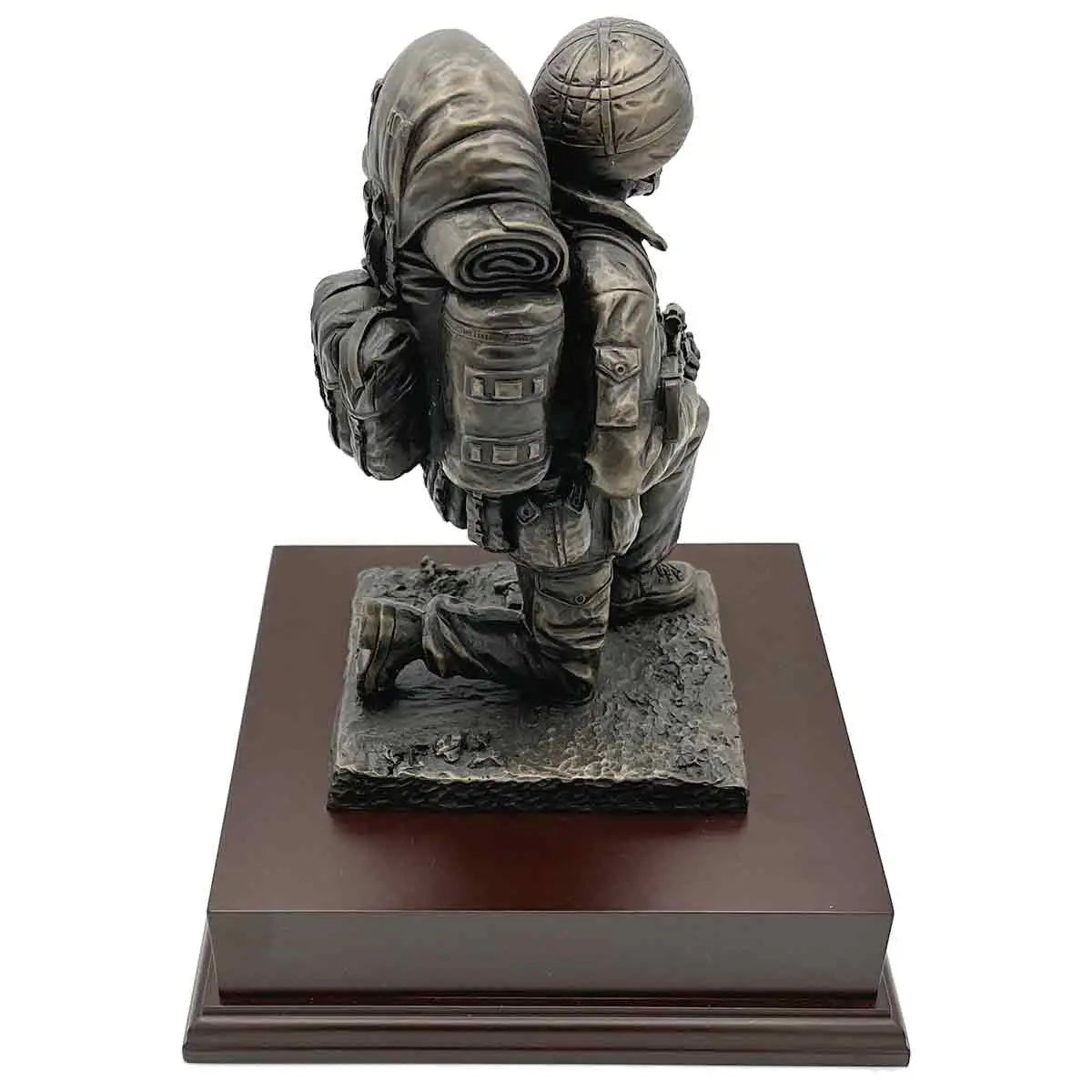 Side view of Kneeling Combat Figure with Beret statue showing soldier's backpack and kneeling pose, a tribute piece for army enthusiasts.  from  John Bull Clothing 