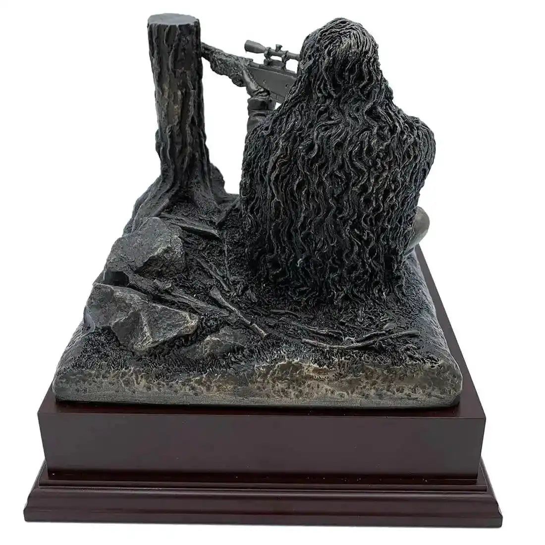 Detailed rear view of Kneeling Sniper Bronze Resin Figurine showing textured ghillie suit and tactical setting on rosewood base for home or office display.  from  John Bull Clothing 
