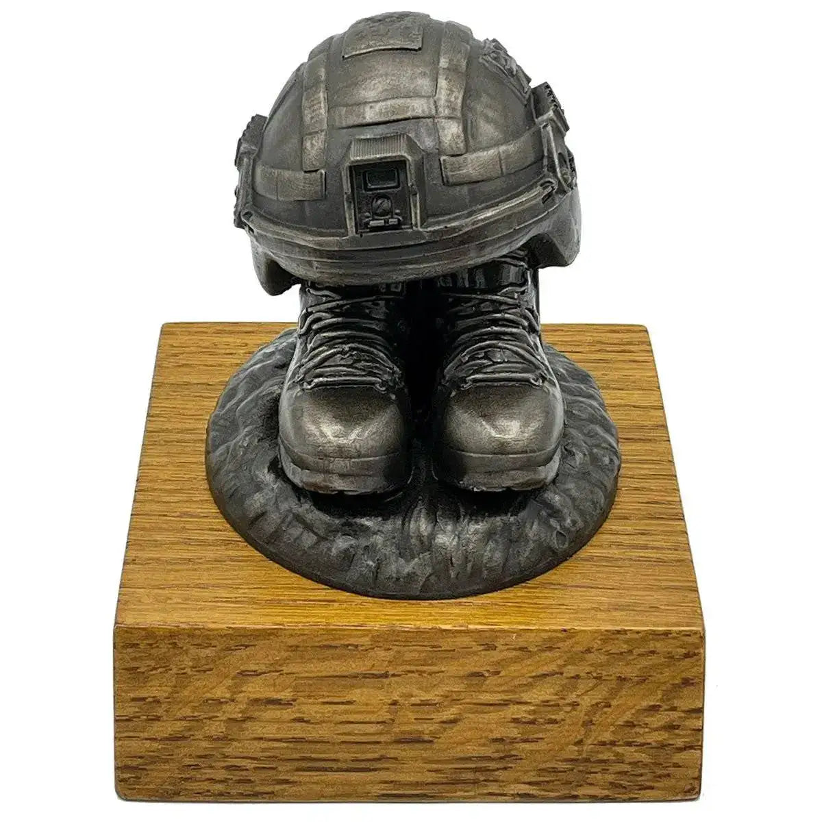 Front view of Helmet and Boots Statue Bronze Resin with lifelike army helmet and boots on a wooden plinth, ideal for military collectors.  from  John Bull Clothing 