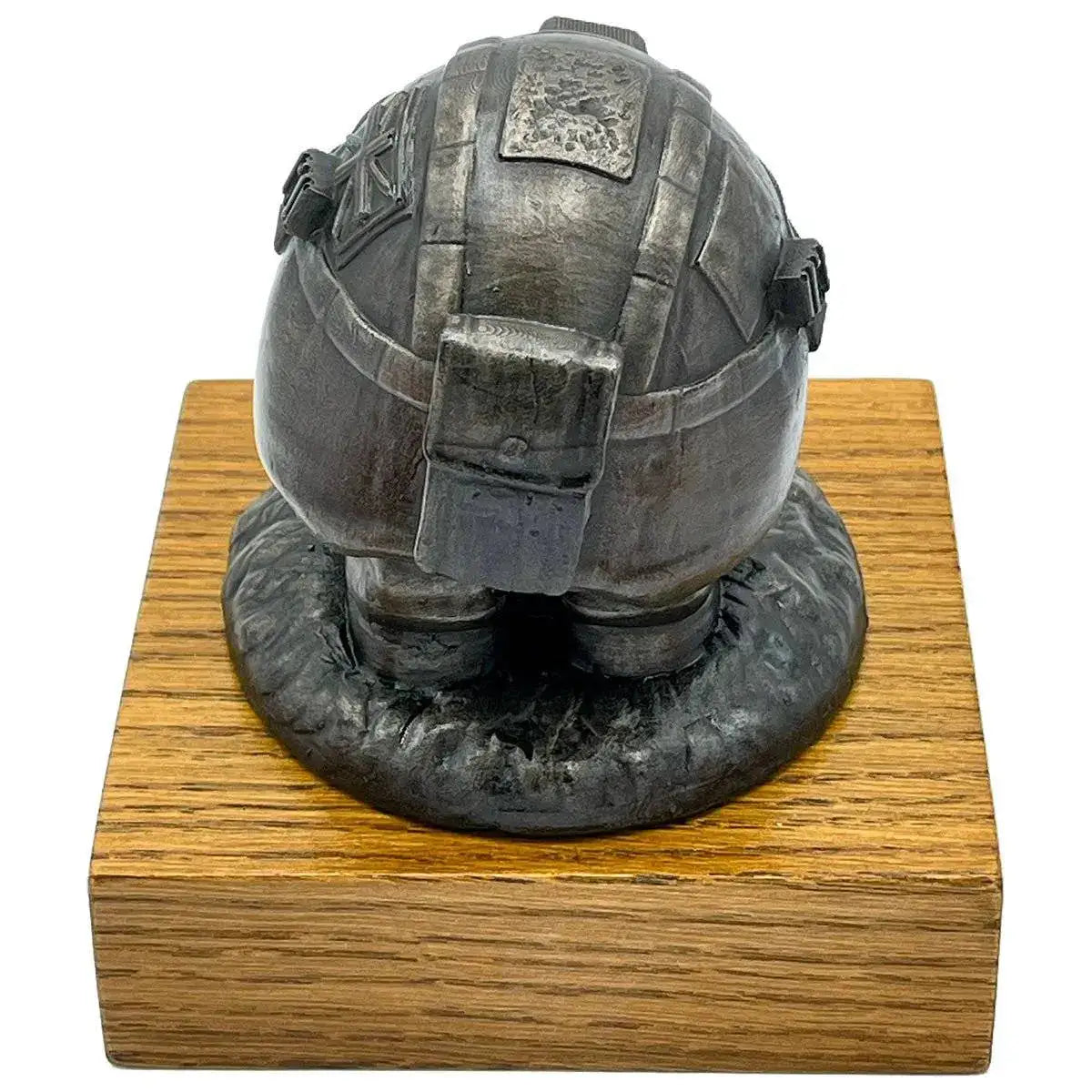 Rear view of Helmet and Boots Statue Bronze Resin with helmet strap and texture details, mounted on a polished wooden base for display.  from  John Bull Clothing 