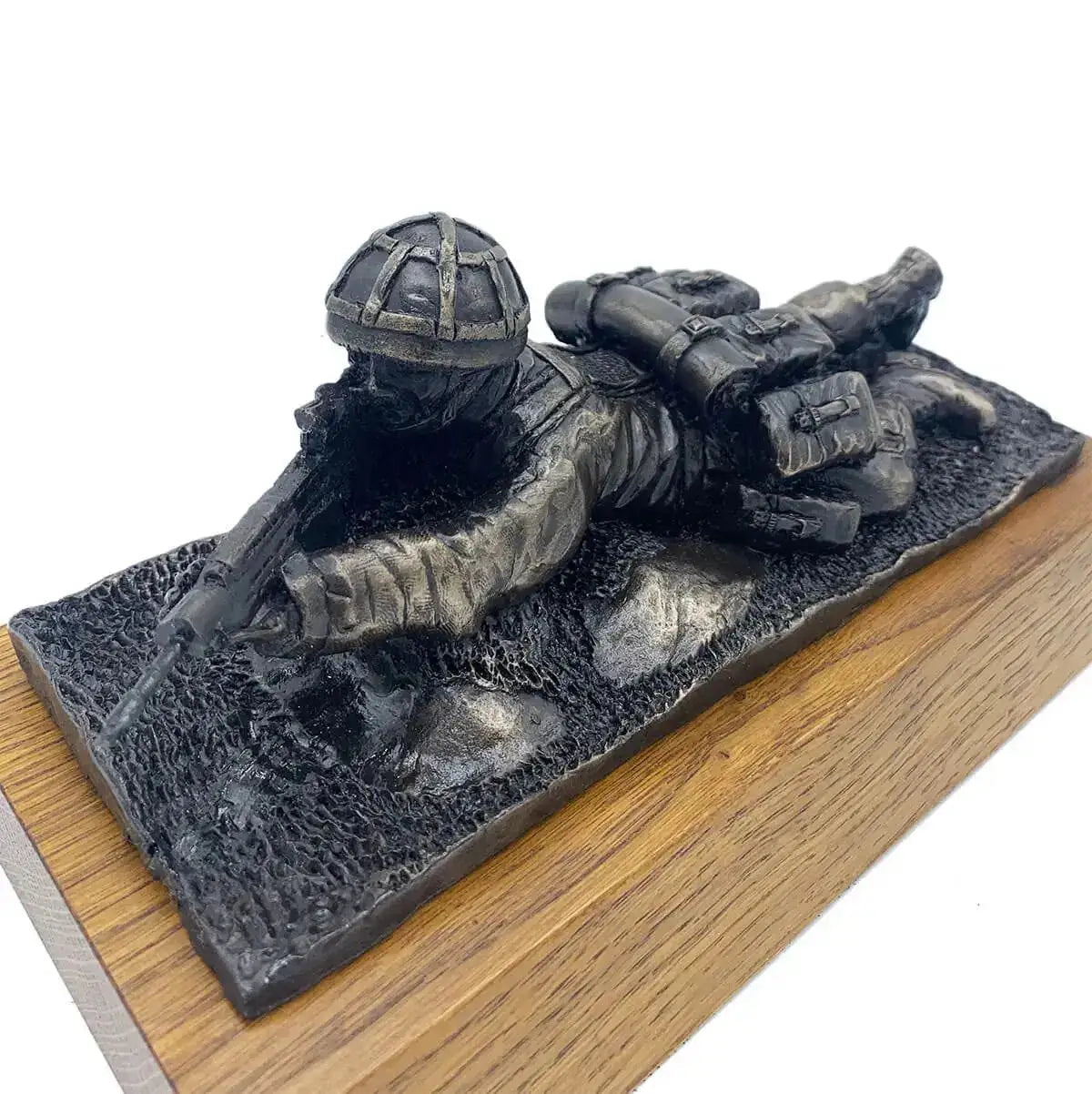 Angled view of Prone Soldier with SA80 Bronze Resin Statue on wood base, showcasing intricate uniform and weapon craftsmanship.  from  John Bull Clothing 