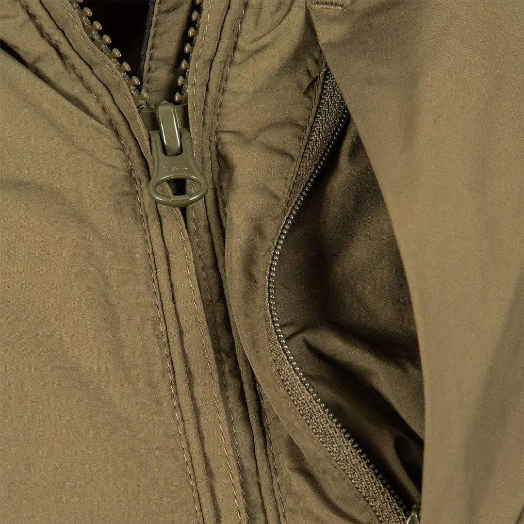 Close-up of Snugpak Arrowhead Insulated Jacket Olive WGTE zipper and inner lining, showcasing high-quality stitching and thermal insulation.  from  John Bull Clothing 
