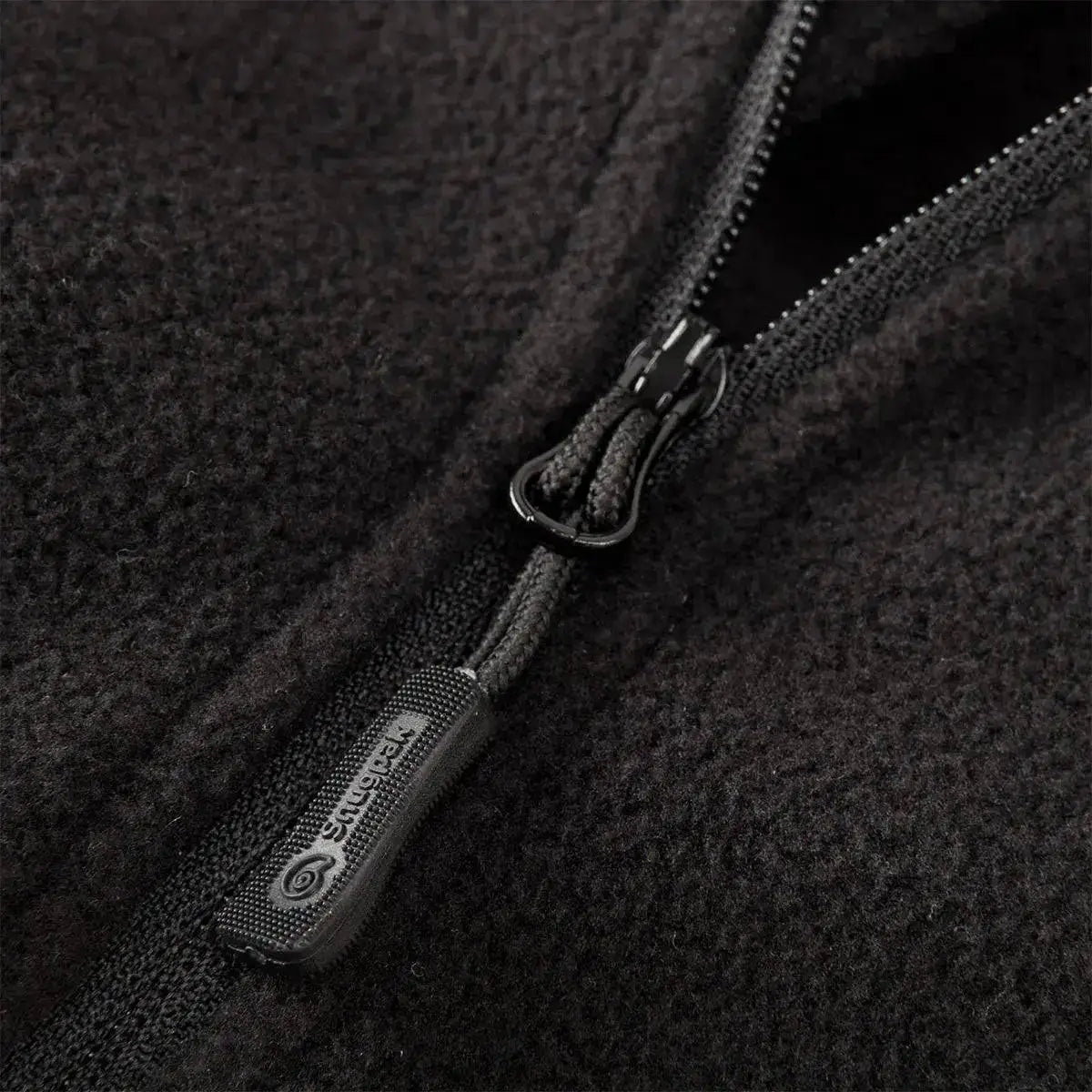 Close-up of Snugpak Impact Black Fleece Shirt zipper, highlighting durable construction and soft fleece material for enhanced comfort and insulation.  from  John Bull Clothing 