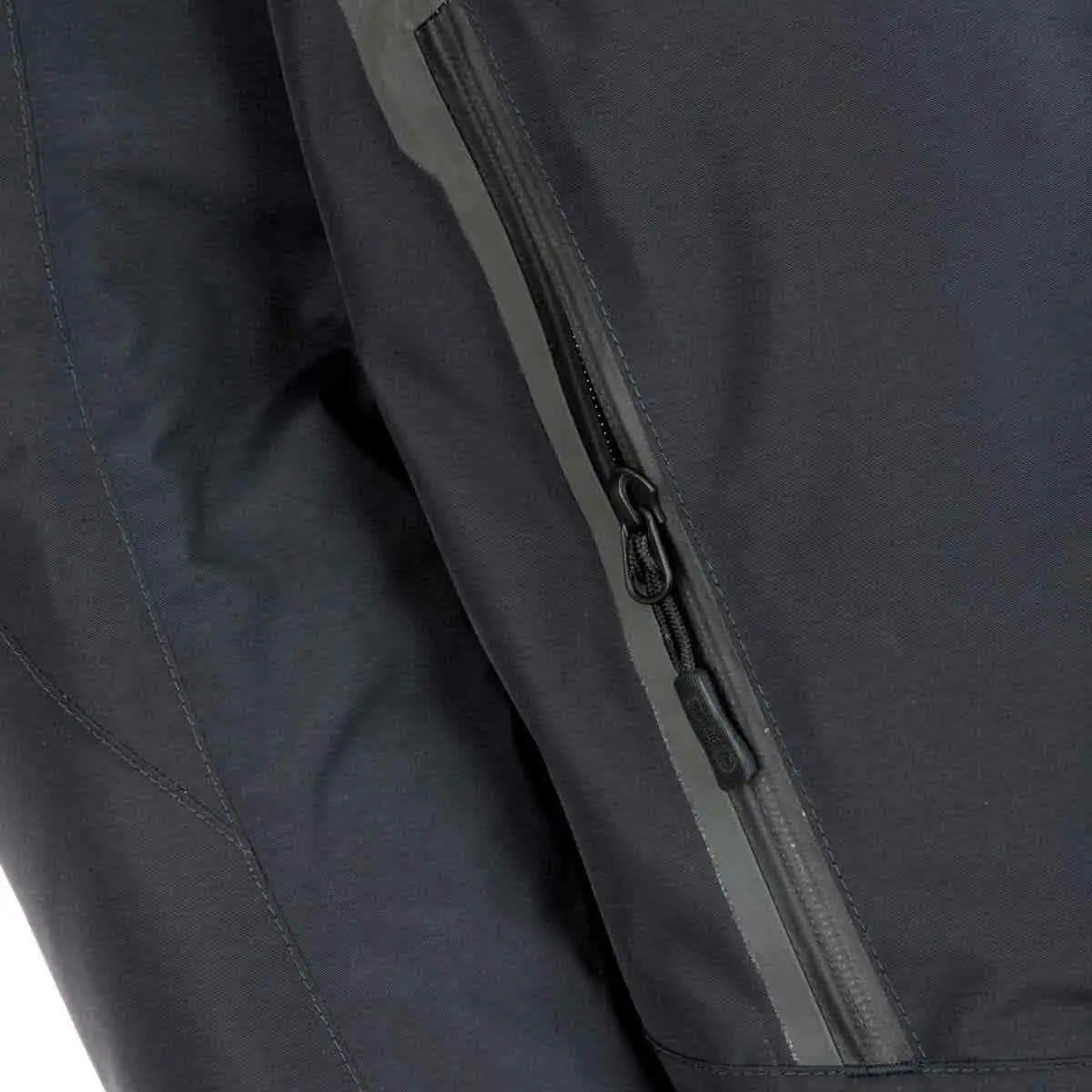 Zippered pocket of Snugpak Torrent Waterproof Black Jacket with waterproof seal for secure and dry storage outdoors.  from  John Bull Clothing 