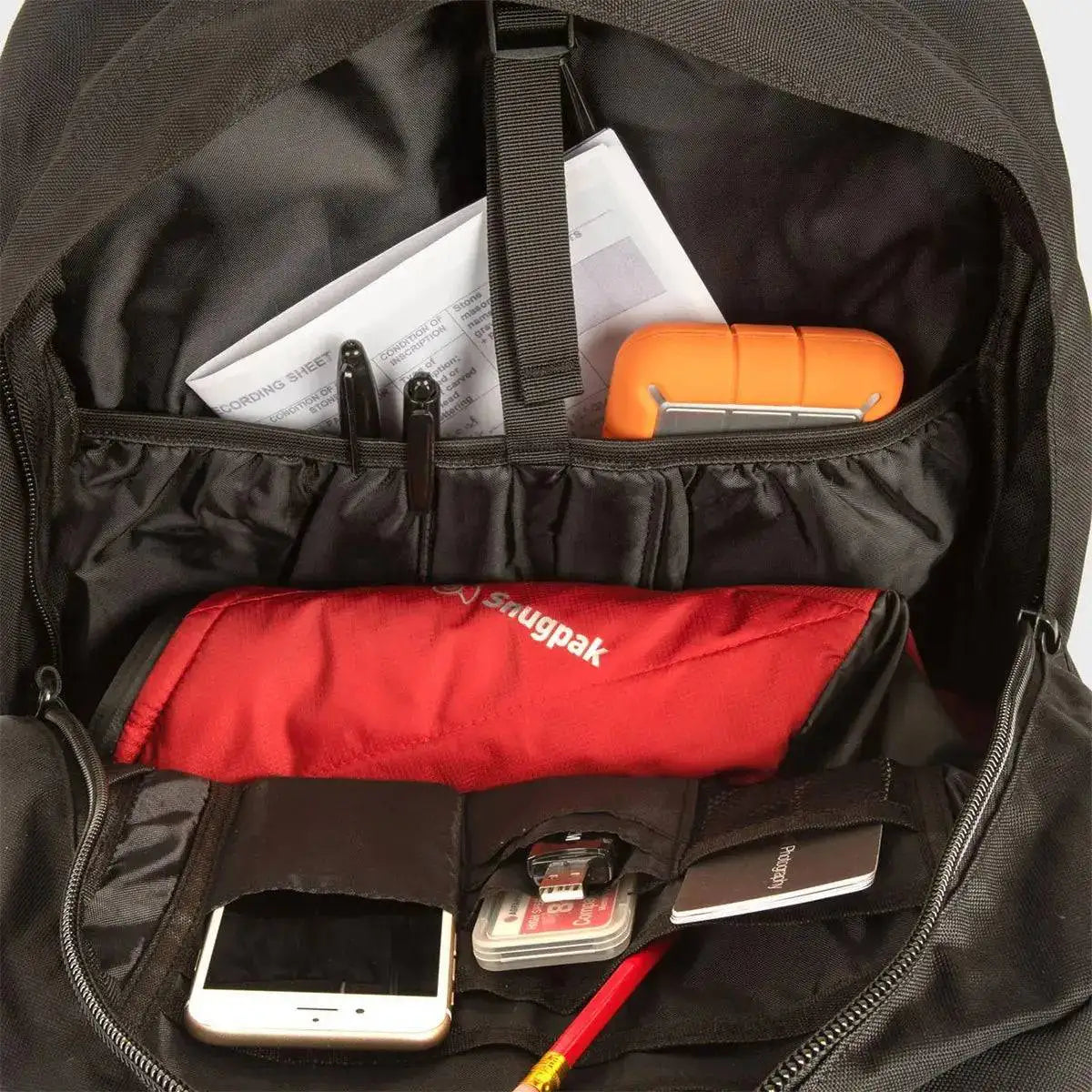 Interior of the Snugpak Xocet 35L Rucksack displaying multiple compartments, organizer pockets, and ample storage space for gear, electronics, and essentials.  from  John Bull Clothing 