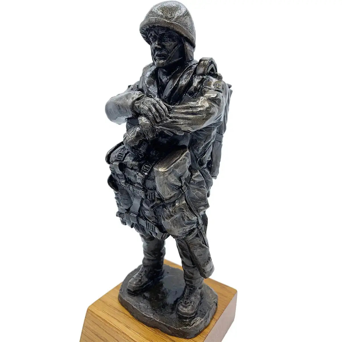 Close-up angled view of Bronze Resin Airborne Drop Order Statue with lifelike paratrooper expression and tactical gear on oak base.
