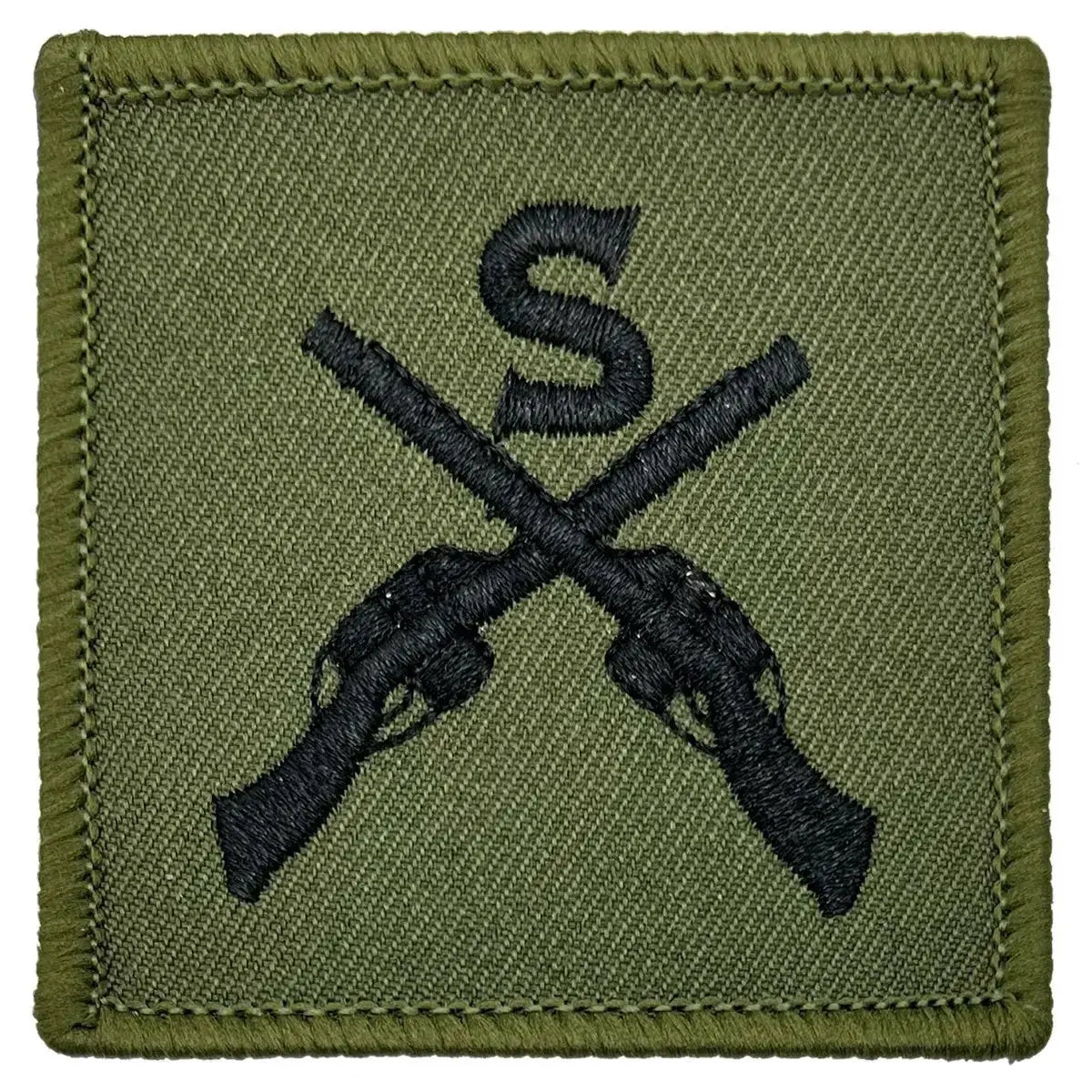 Close-up of Sniper Trade TRF - Iron On Patch | John Bull Clothing showing detailed embroidery of black crossed rifles and 'S' on green cotton fabric.